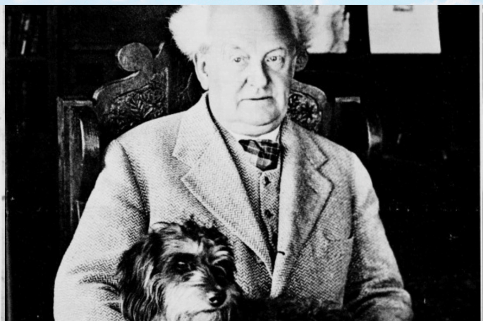Das Bild zeigt Gerhart Hauptmann mit seinem Hund. die Aufnhame stammt aus dem Jahr 1932, in dem der Dichter seinen 70. Geburtstag feiert.