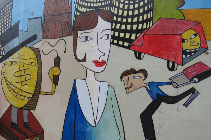 Das Bild zeigt abstrakte Personen in einer Großstadt.